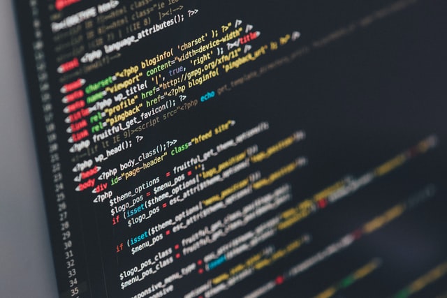 Code against a black background on a laptop