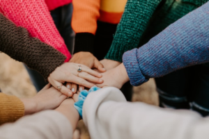 Hands together in a pow-wow.