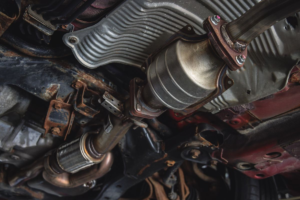 Catalytic converter attached to an old car.