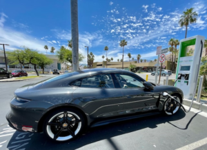Porcshe plugged into EV charging station.