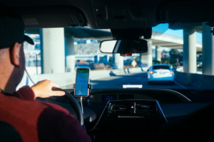 Uber driver looking at directions on phone.