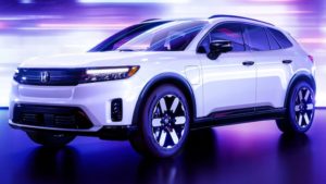 An electric Honda on a showroom stage.